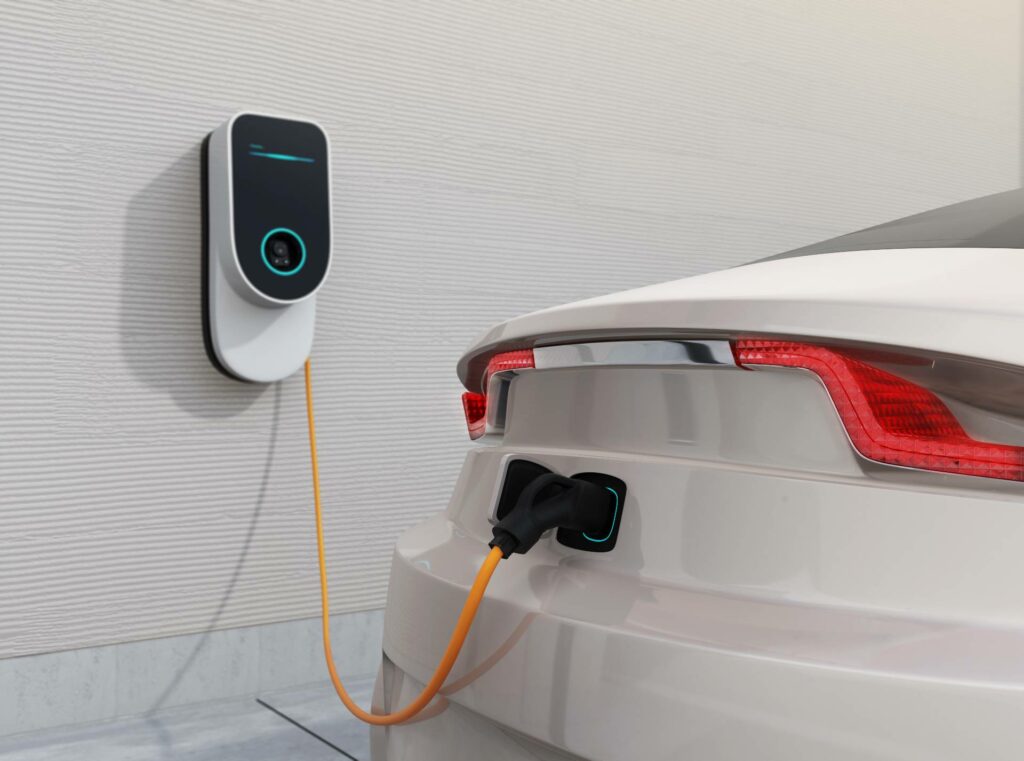 car charger mounted on wall next to car